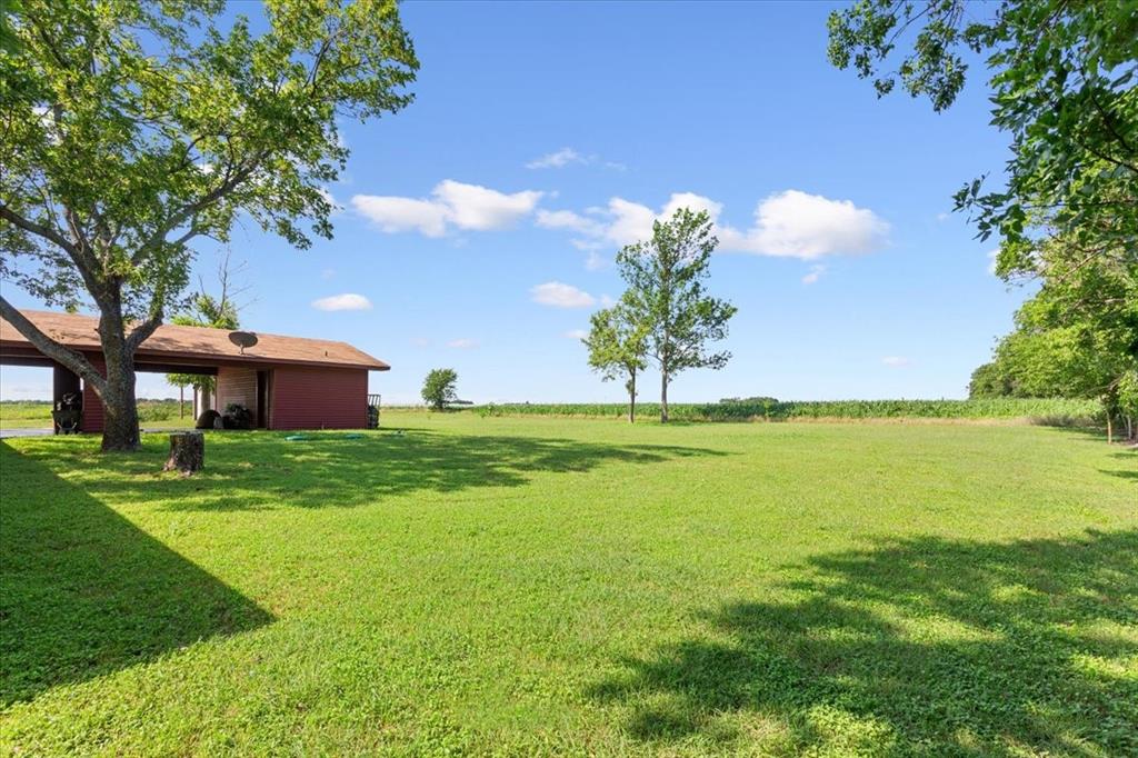 221 County Road 157 Riesel, TX 76682 - Photo 28 of 30 a front view of a house with garden