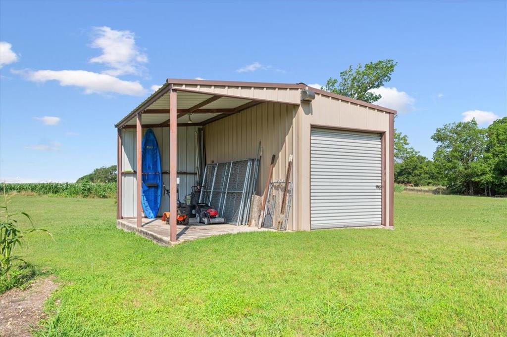 221 County Road 157 Riesel, TX 76682 - Photo 29 of 30 a view of a wooden house with a yard