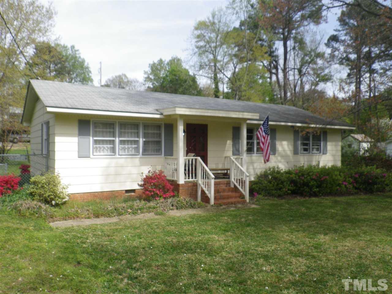 5024 Wickham Road Raleigh, NC 27606 - Photo 2 of 14 a view of a house with backyard sitting area and garden