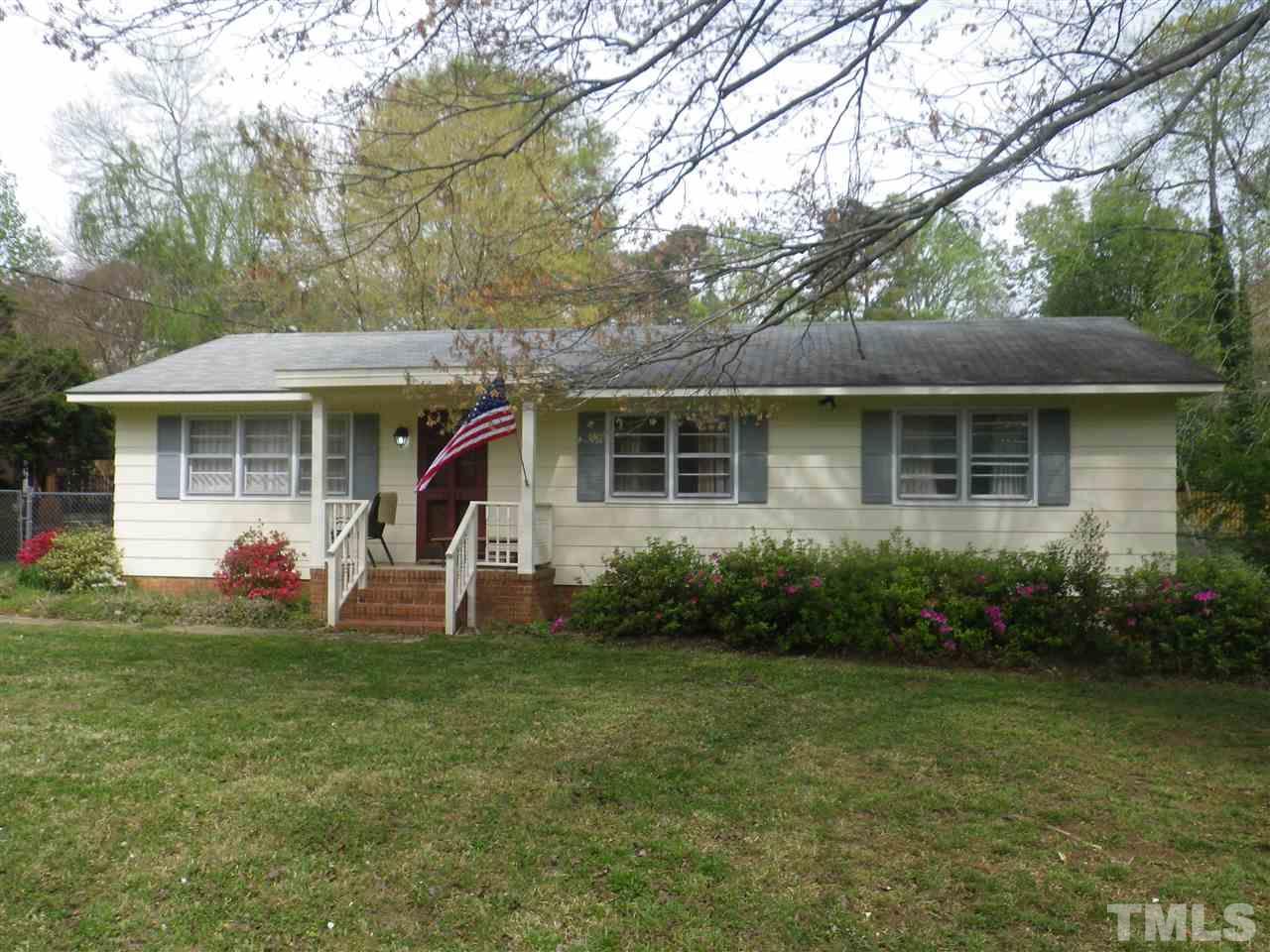 5024 Wickham Road Raleigh, NC 27606 - Photo 3 of 14 a view of a house with a yard and sitting area