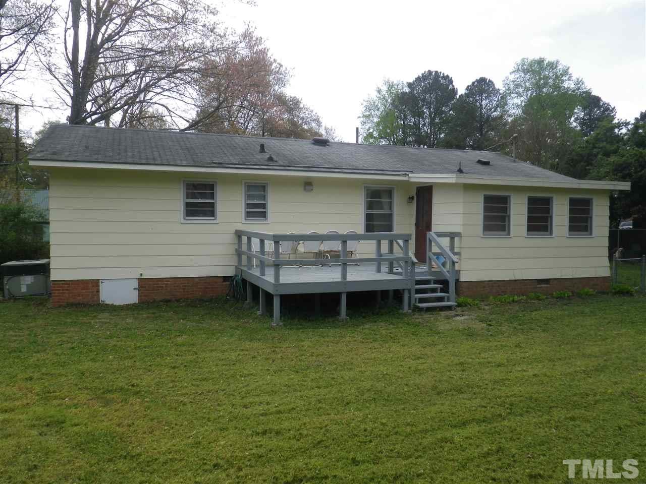 5024 Wickham Road Raleigh, NC 27606 - Photo 9 of 14 a view of a house with a yard