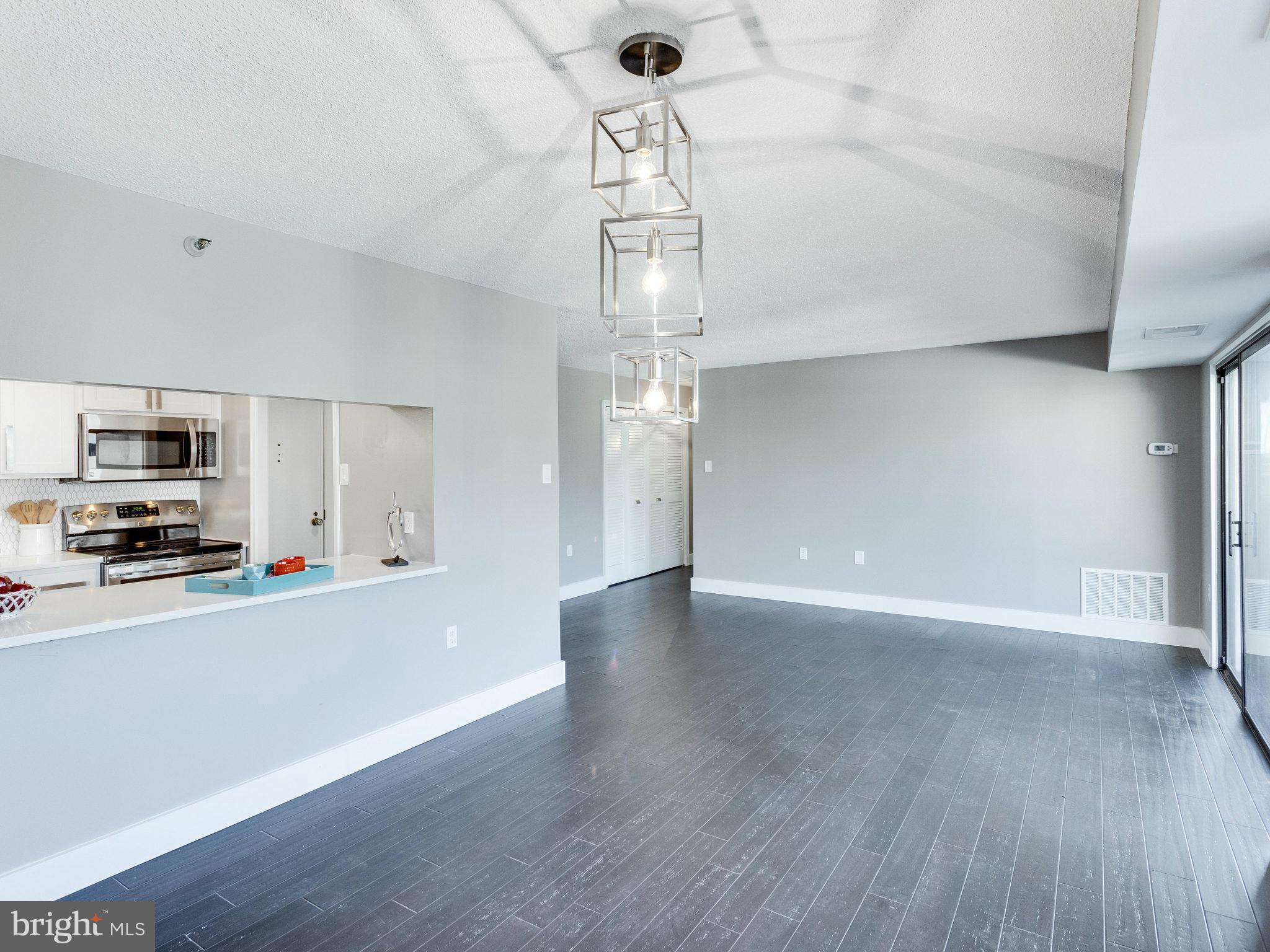 1301 North Courthouse Road, Unit 1411 Arlington, VA 22201 - Photo 11 of 30 a view of a livingroom with a kitchen