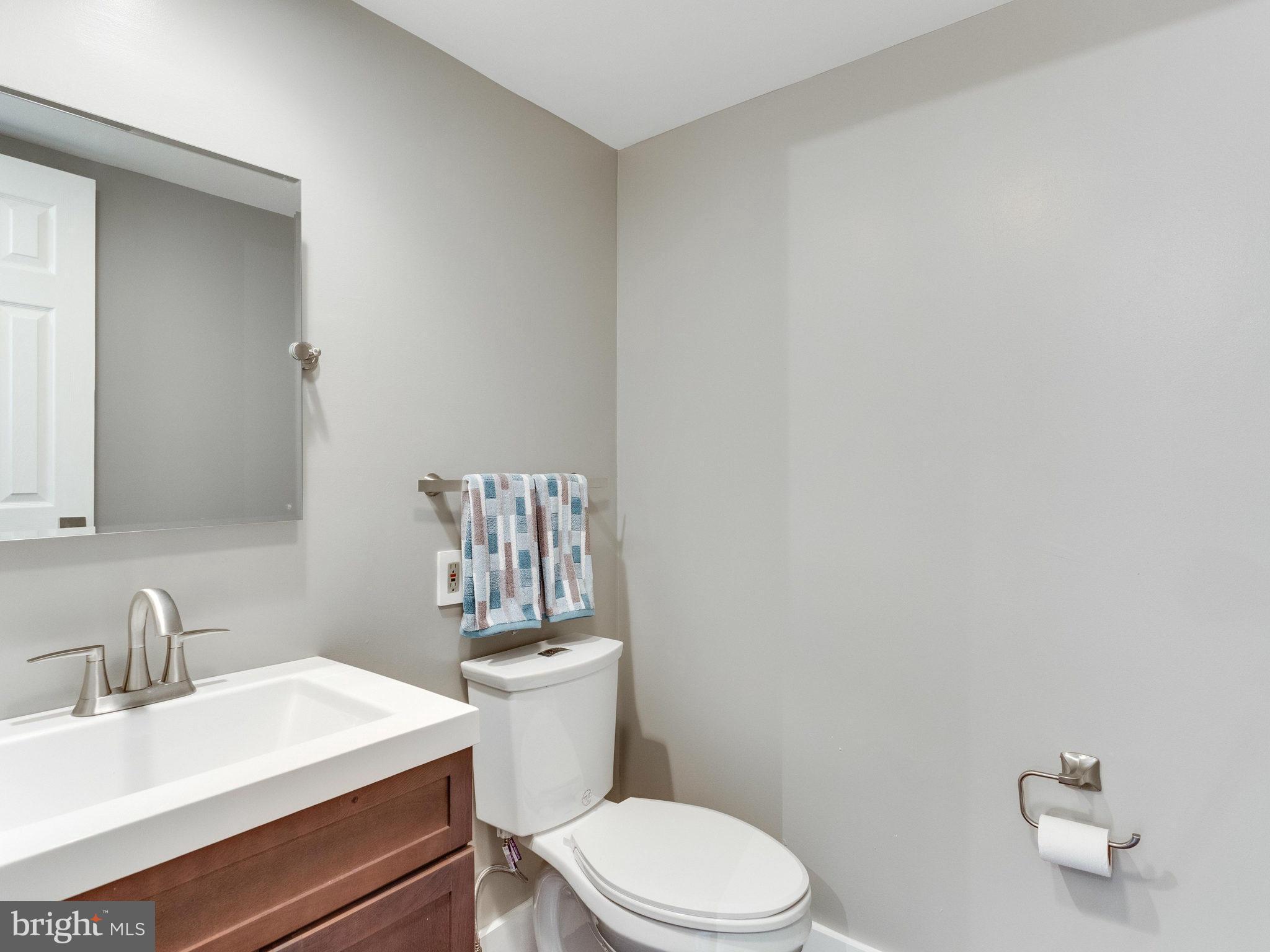 1301 North Courthouse Road, Unit 1411 Arlington, VA 22201 - Photo 15 of 30 a white toilet sitting next to a bathroom sink