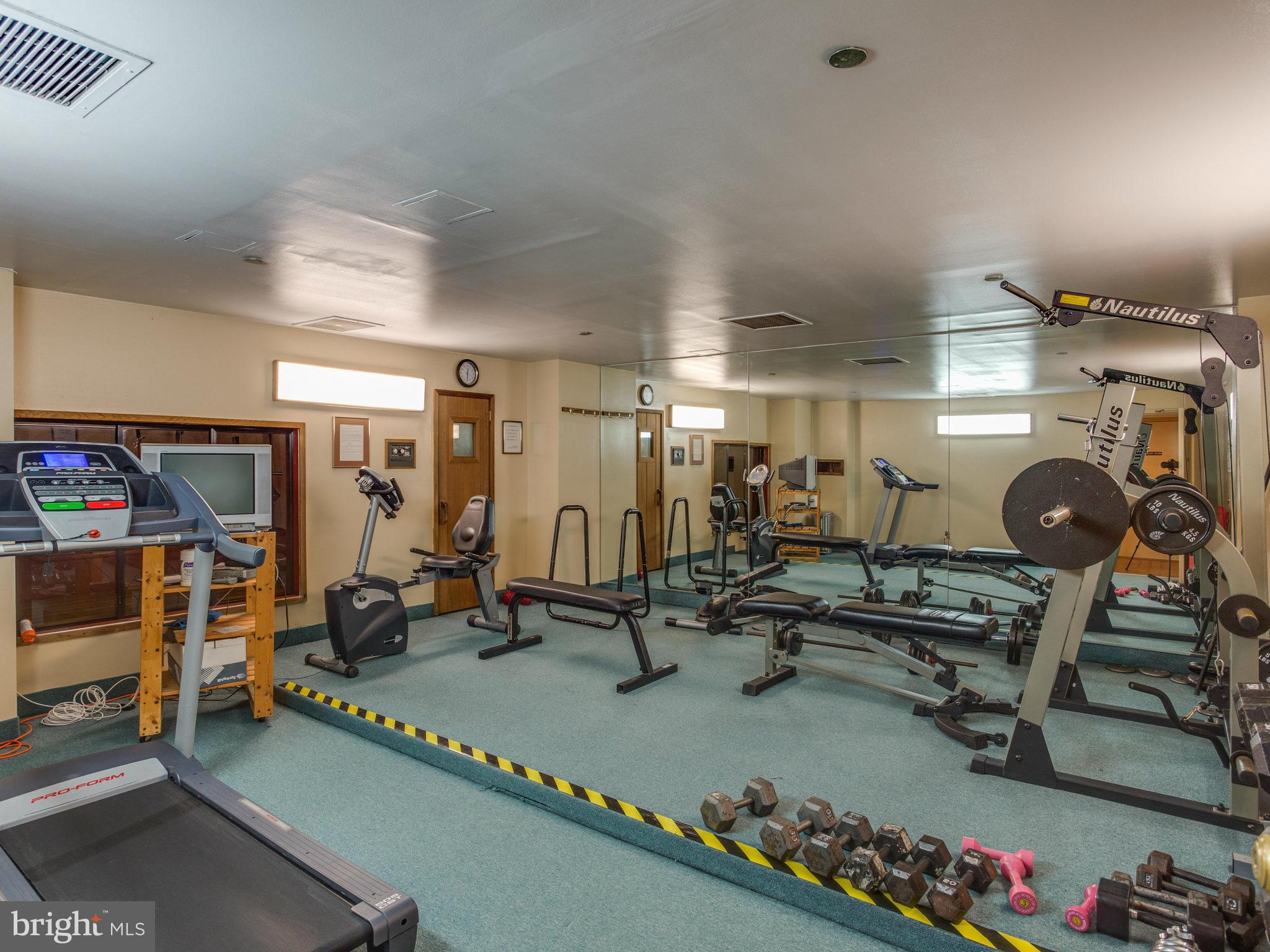 1301 North Courthouse Road, Unit 1411 Arlington, VA 22201 - Photo 25 of 30 a view of a room with gym equipment