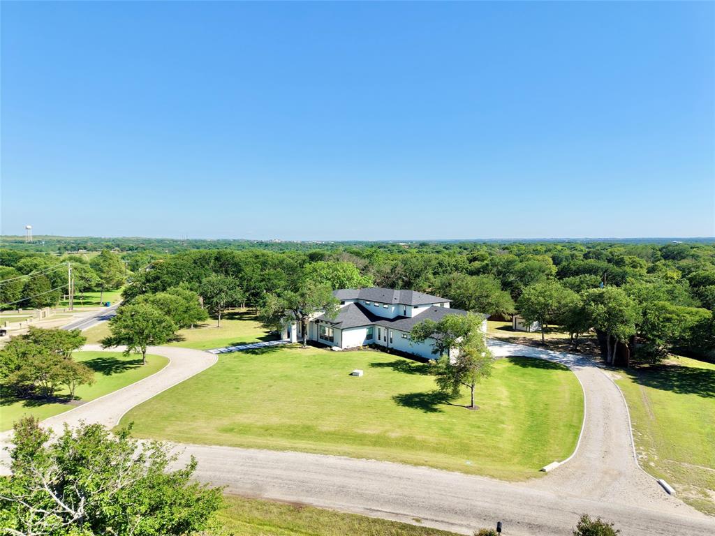 428 Squaw Creek Road Willow Park, TX 76087 - Photo 2 of 34 a view of a swimming pool with an outdoor space and seating area