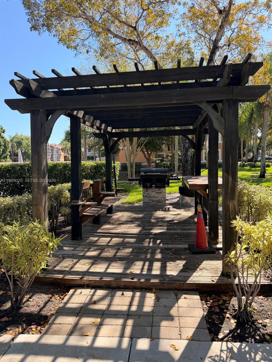 8821 Wiles Road, Unit 108 Coral Springs, FL 33067 - Photo 21 of 46 a view of outdoor space