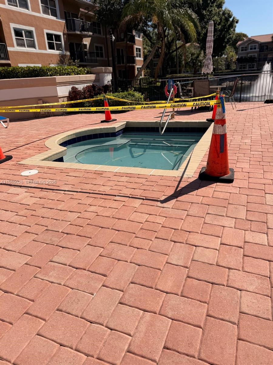 8821 Wiles Road, Unit 108 Coral Springs, FL 33067 - Photo 23 of 46 a view of swimming pool with chairs