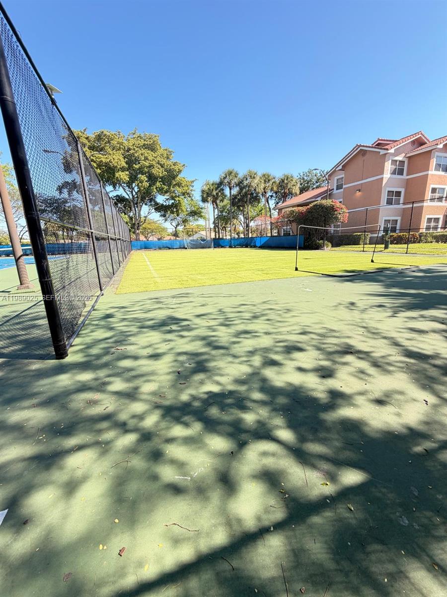 8821 Wiles Road, Unit 108 Coral Springs, FL 33067 - Photo 29 of 46 a view of a swimming pool with an ocean view