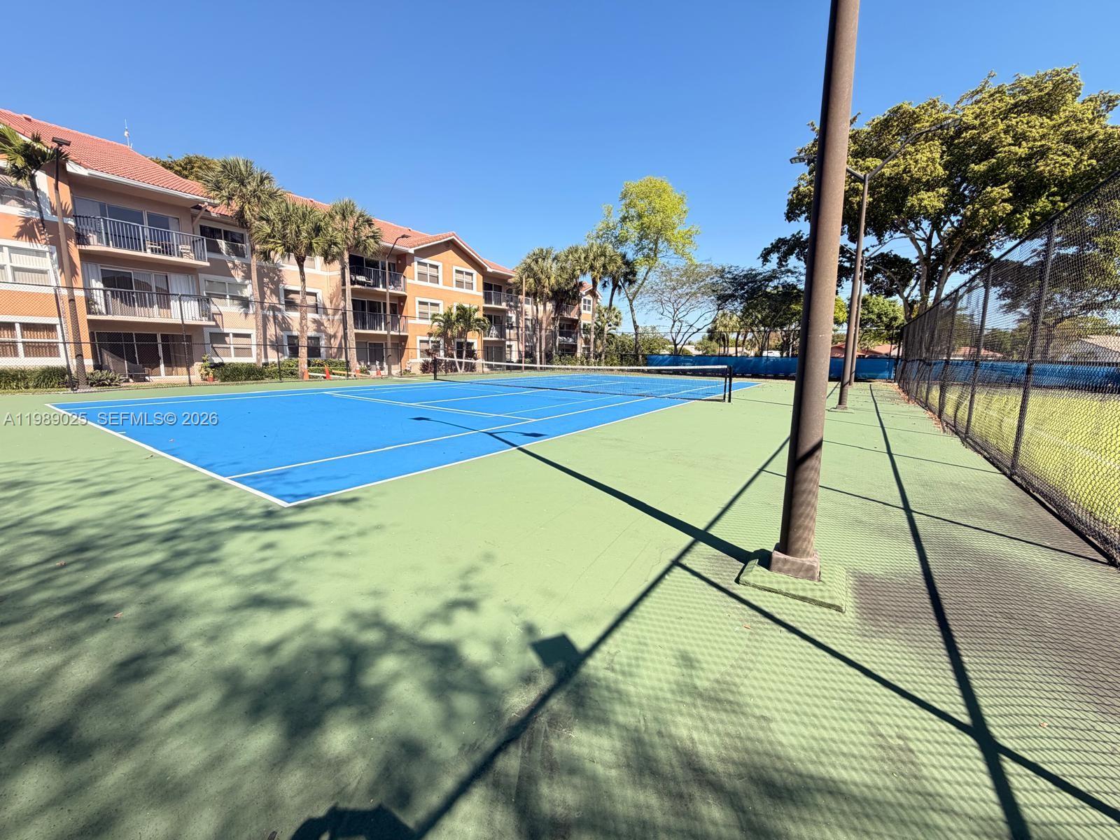 8821 Wiles Road, Unit 108 Coral Springs, FL 33067 - Photo 30 of 46 a view of an outdoor space pool patio and lake view