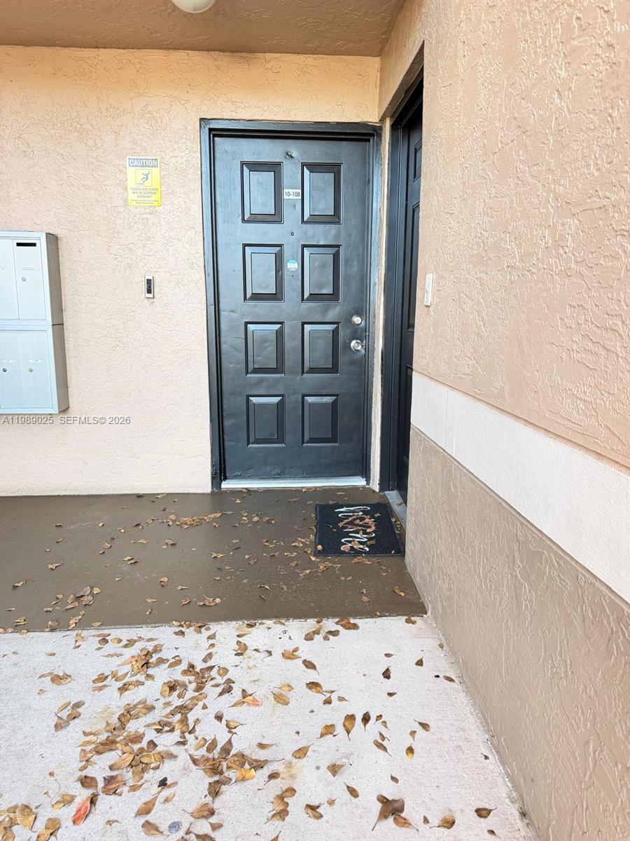 8821 Wiles Road, Unit 108 Coral Springs, FL 33067 - Photo 3 of 46 a front view of a house