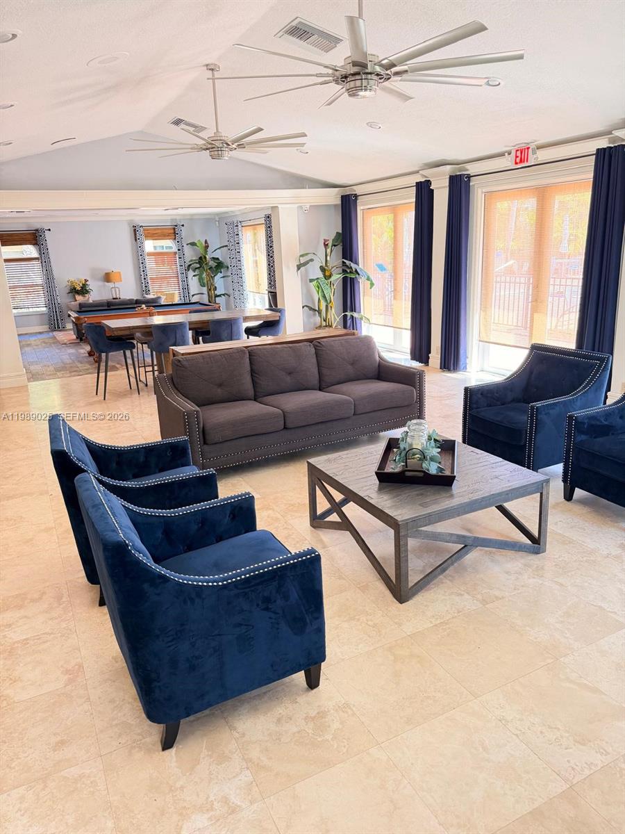 8821 Wiles Road, Unit 108 Coral Springs, FL 33067 - Photo 33 of 46 a living room with furniture and a large window