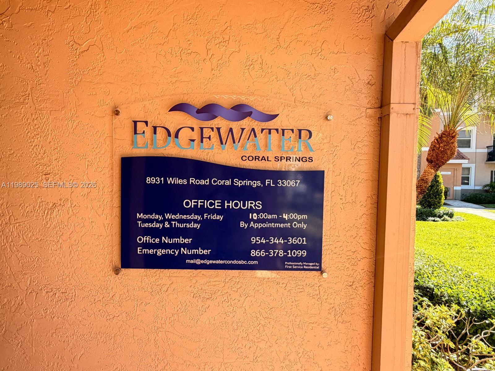 8821 Wiles Road, Unit 108 Coral Springs, FL 33067 - Photo 39 of 46 a sign on the wall of a building