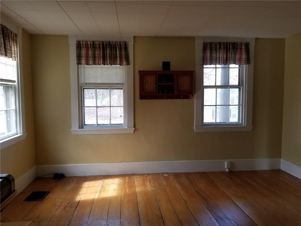 6 Maple Street Hallowell, ME 04347 - Photo 10 of 27 Living room looks out onto front porch.