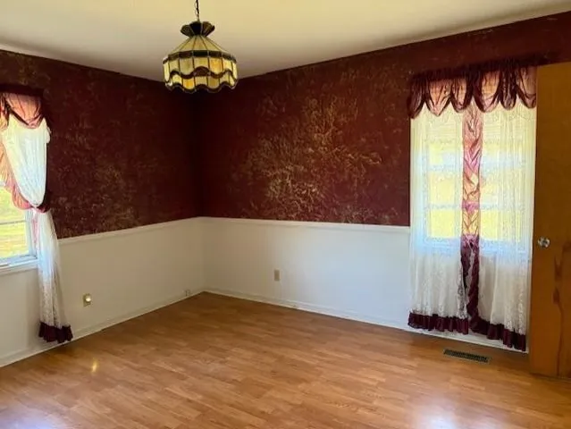 a view of a golf course with a tree