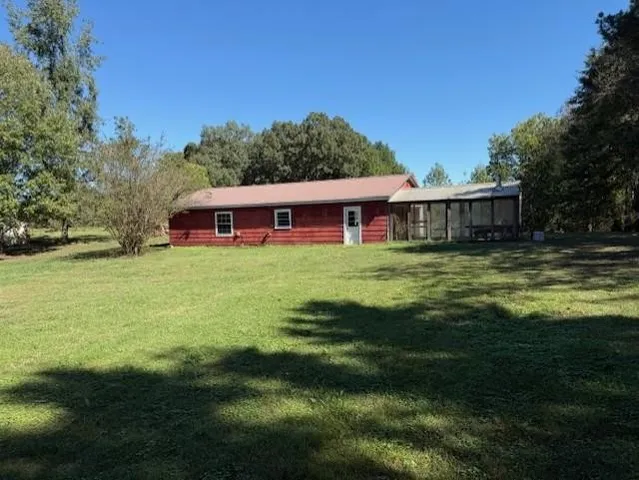 a backyard of a house with lots of green space
