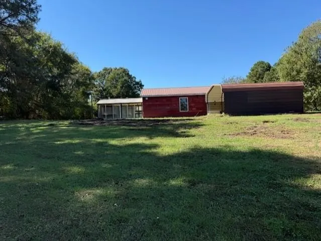 a view of a field with an ocean