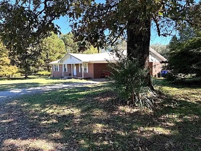 a backyard of a house with lots of green space