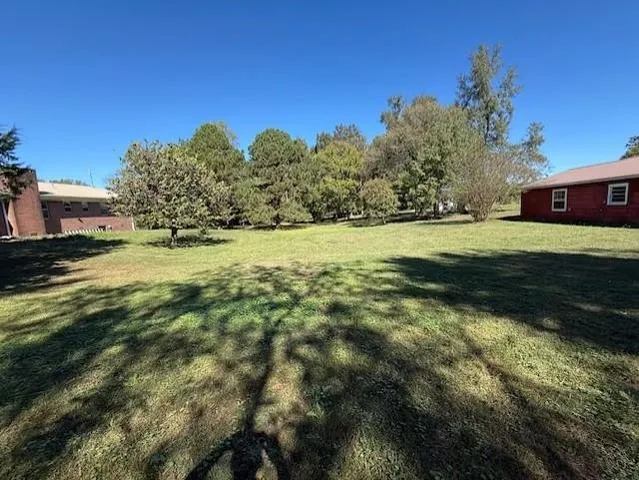 a view of a big house with a big yard