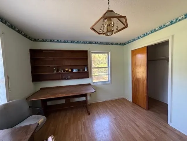 a bedroom with a bed and a television