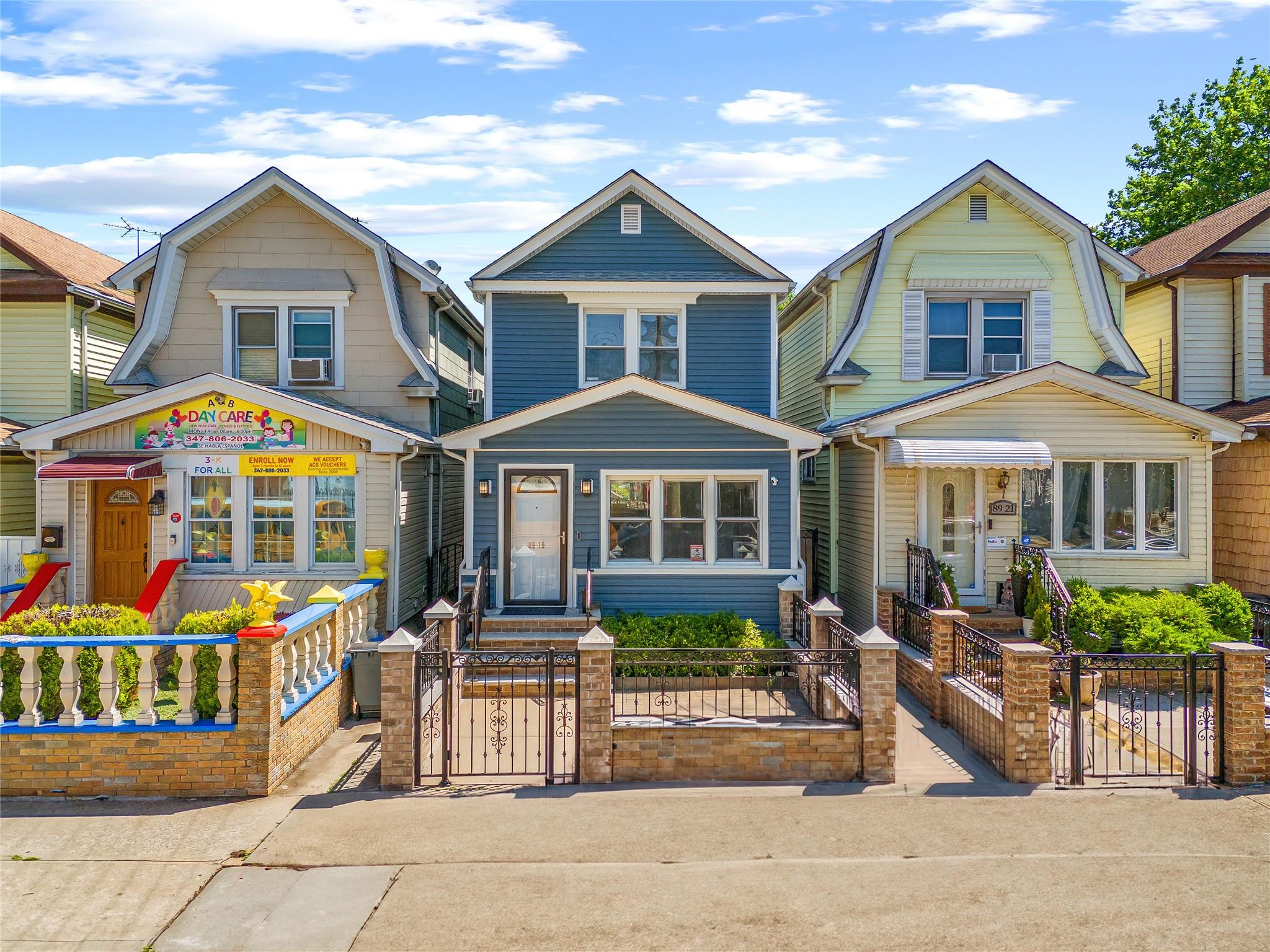 a front view of a residential houses with street