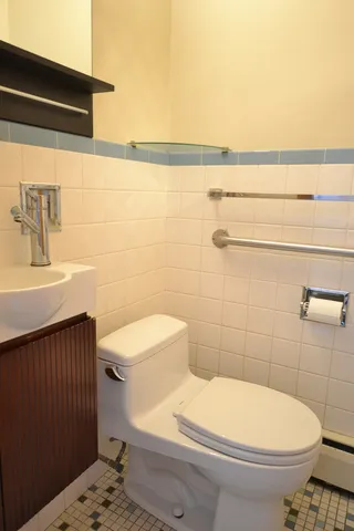 a bathroom with a toilet and a sink