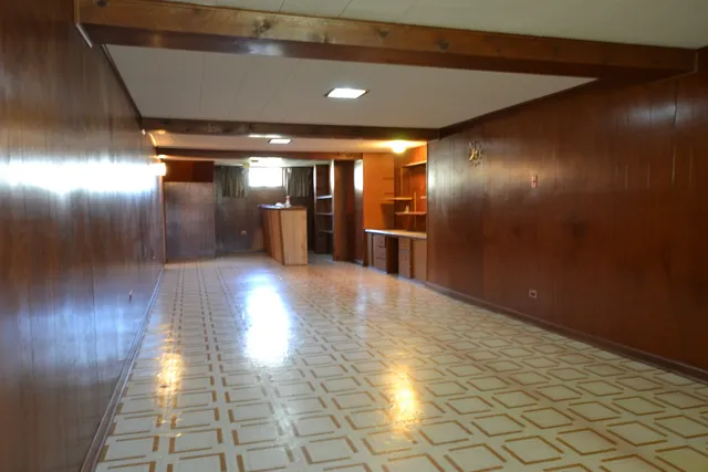 a view of gallery with wooden floor