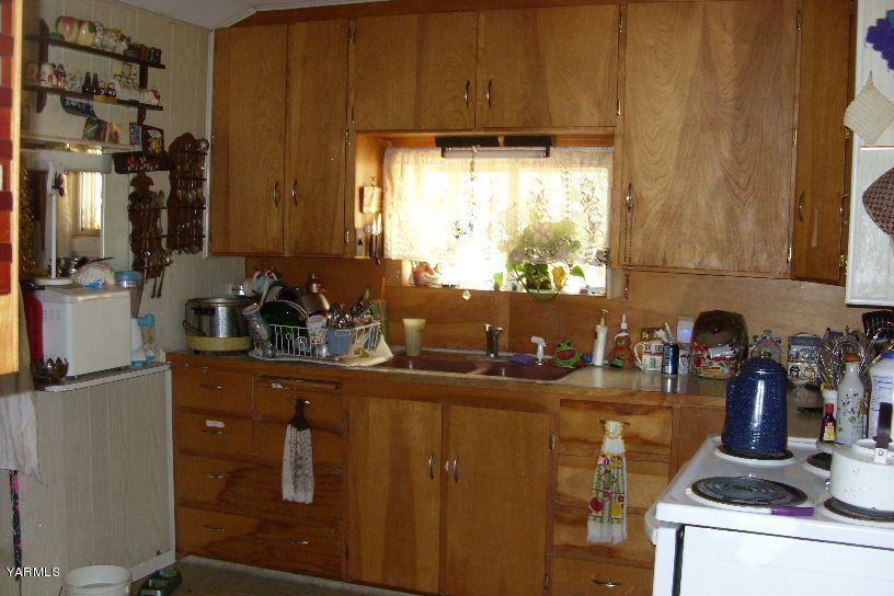 860 Franklin Road Tieton, WA 98947 - Photo 3 of 9 a kitchen with a sink and cabinets