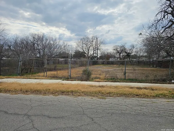 a view of a yard with a lake view