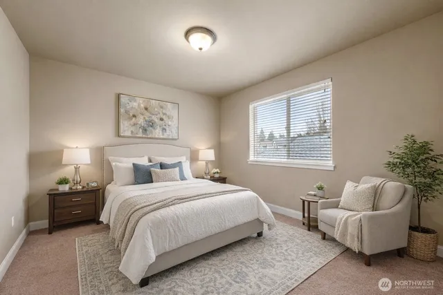 a bedroom with a bed and a couch