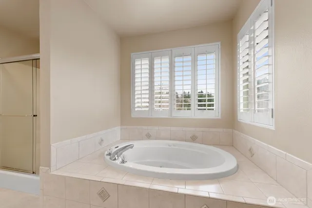a bathroom with a bathtub and window