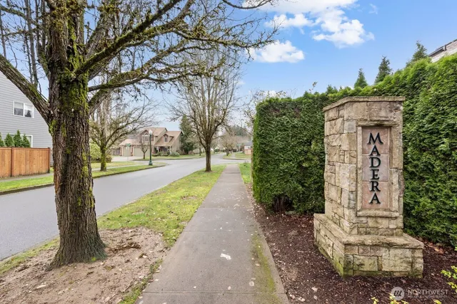 a pathway of a house with a yard