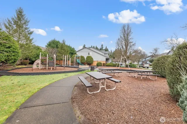 a view of a swimming pool with a table and chairs