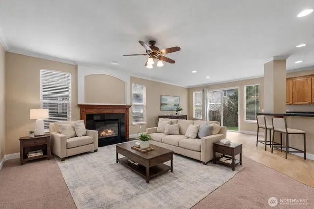a living room with furniture and a fireplace