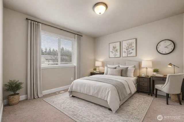 a bedroom with a large bed and a window