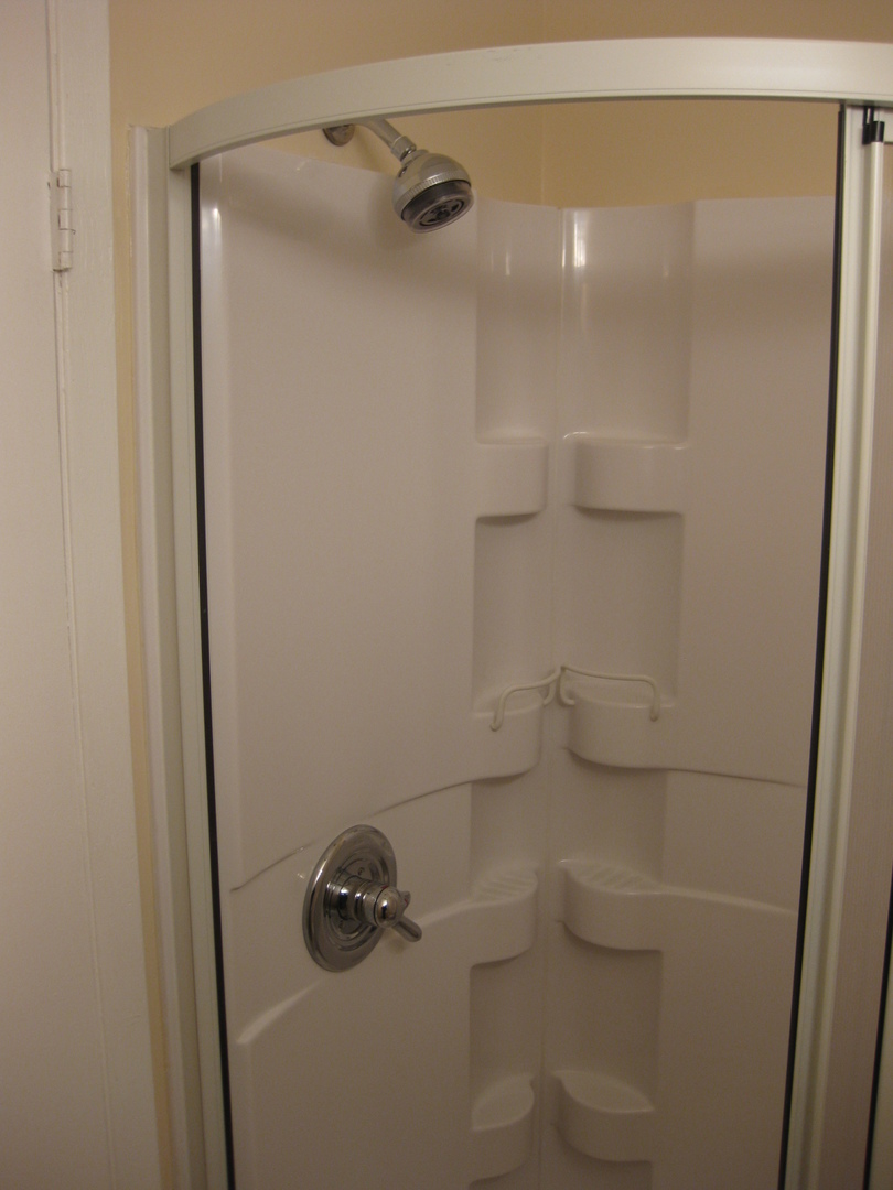 429 Pacific Court Wheeling, IL 60090 - Photo 12 of 16 a bathroom with a shower and toilet