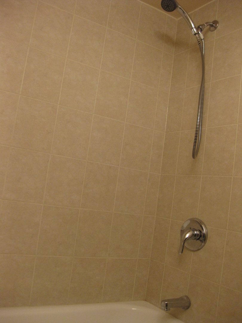 429 Pacific Court Wheeling, IL 60090 - Photo 14 of 16 a bathroom with a shower