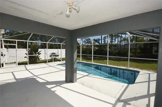 a view of a swimming pool with a large window