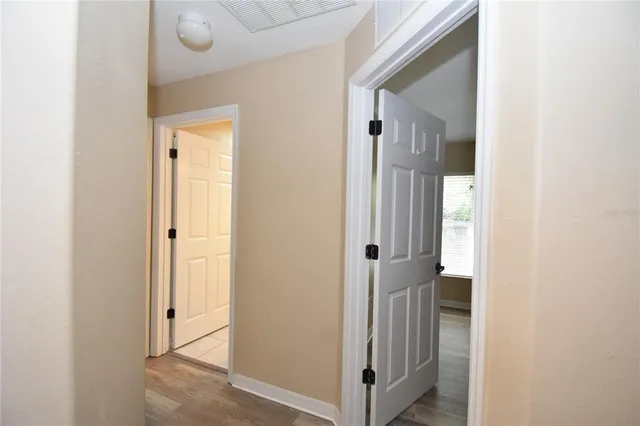 a view of a bathroom from the hallway