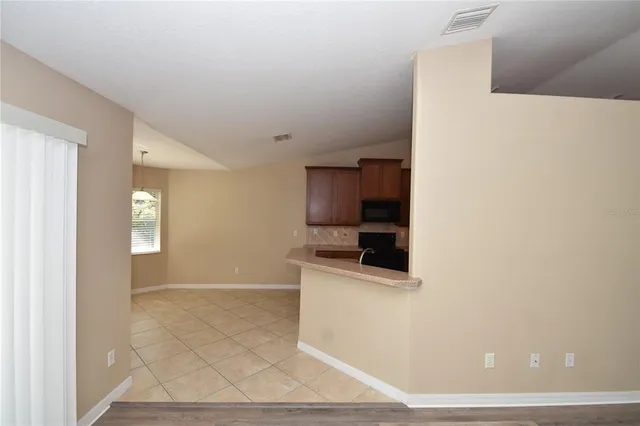 a view of a kitchen from the hallway