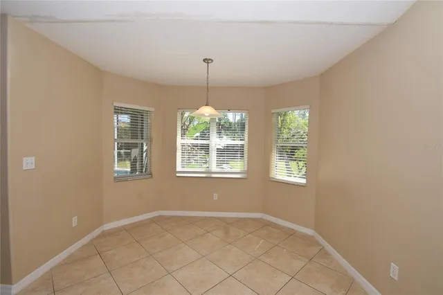 a view of an empty room with windows