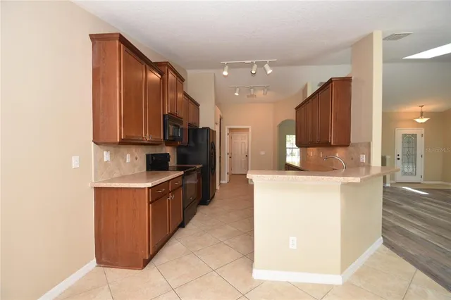 a large kitchen with stainless steel appliances