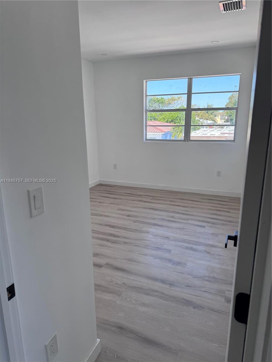 950 79th Terrace Miami Beach, FL 33141 - Photo 4 of 8 a view of an empty room with a window