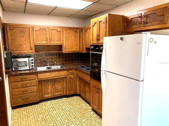 a view of a room with a wooden wall