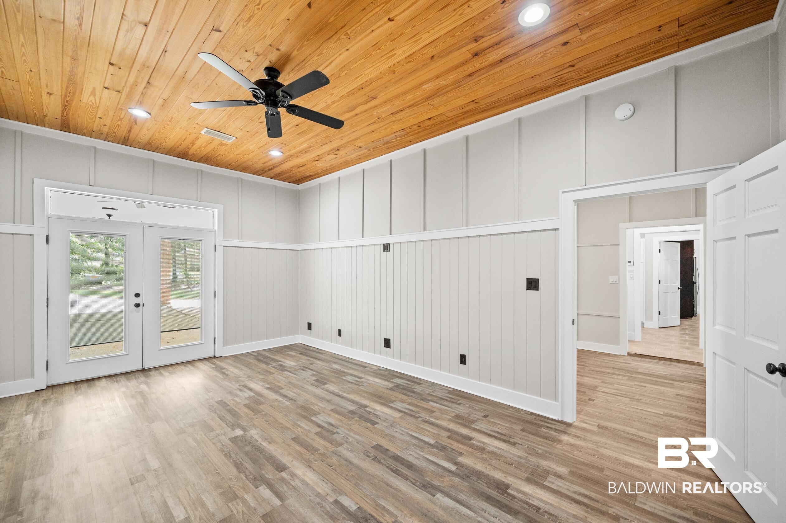 15031 Timber Ridge Drive Loxley, AL 36551 - Photo 26 of 43 Empty room featuring light wood-type flooring, ceiling fan, french doors, and wooden ceiling