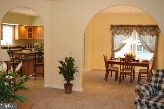 31629 Melson Road Delmar, MD 21875 - Photo 8 of 12 a view of a dining room with furniture and a potted plant