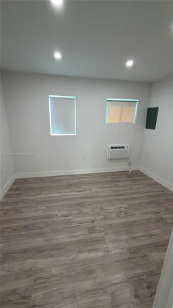 a view of room with wooden floor