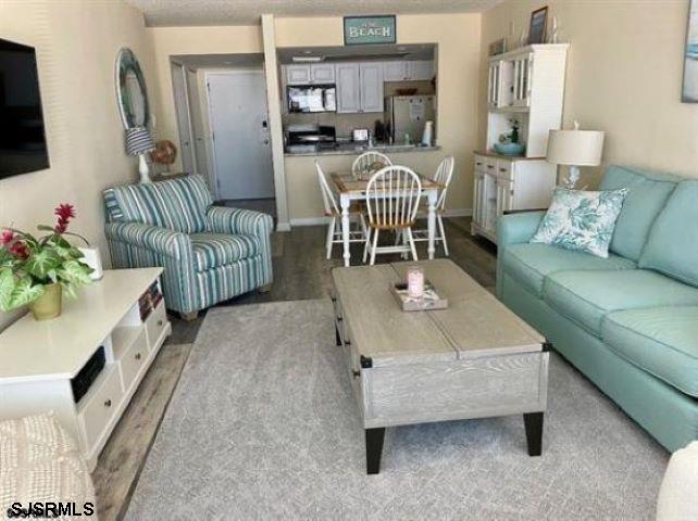4500 West Brigantine Avenue, Unit 1314 Brigantine, NJ 08203 - Photo 3 of 11 a living room with furniture and a potted plant
