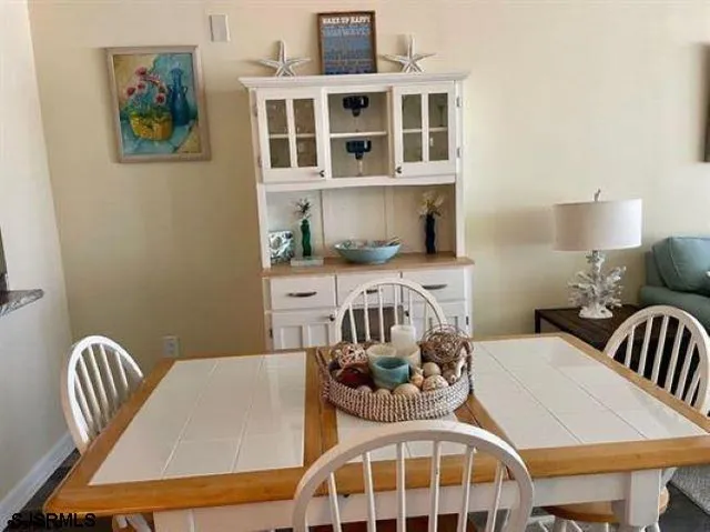 a bedroom with furniture and wooden floor
