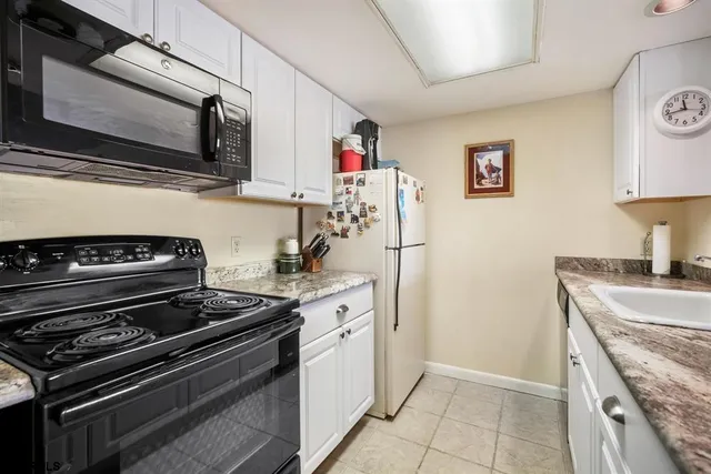 a kitchen with a stove and a microwave