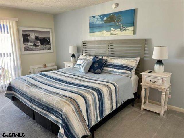 4500 West Brigantine Avenue, Unit 1314 Brigantine, NJ 08203 - Photo 9 of 11 a bedroom with a bed and night stand